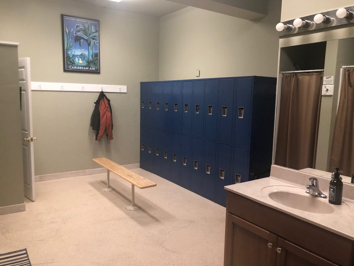 Clean locker room with benches and lockers